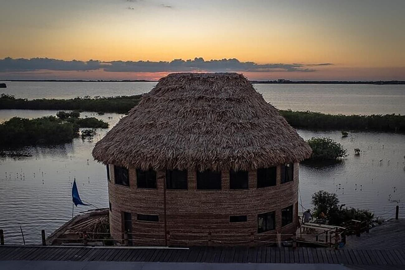 The Mayan overwater restaurant at sunset